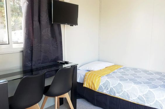 Cube Cabins - bed and TV